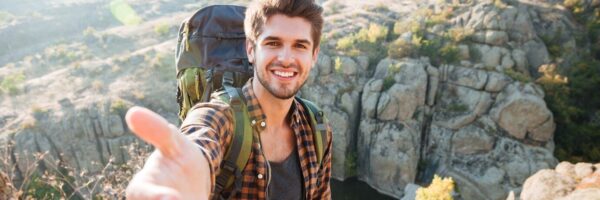 man-takes-hand-near-canyon_171337-62733-1-600x200