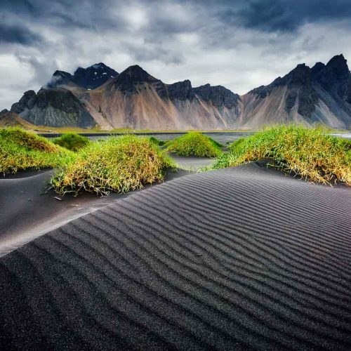 Great wind rippled beach black sand. Picturesque and gorgeous scene. Popular tourist attraction. Location famous place Stokksnes cape, Vestrahorn (Batman Mountain), Iceland, Europe. Beauty world.